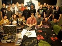 Visceral Games team with auction items photo